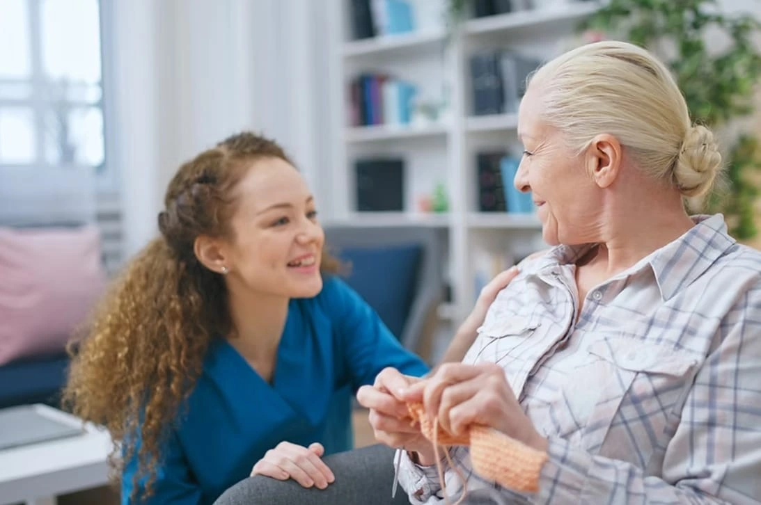 A CareHearths caregiver spending quality time with a senior client at home